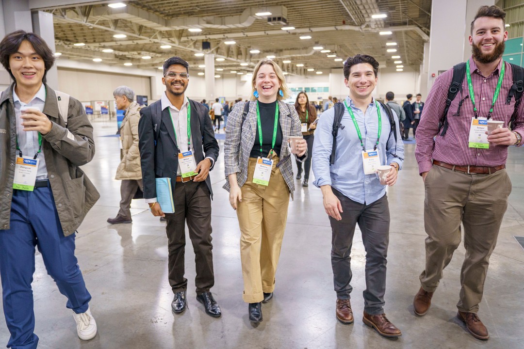 Attendees walking together during the meeting