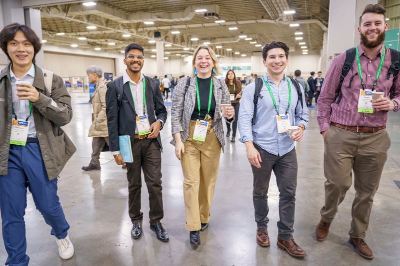 Attendees walking together during the meeting