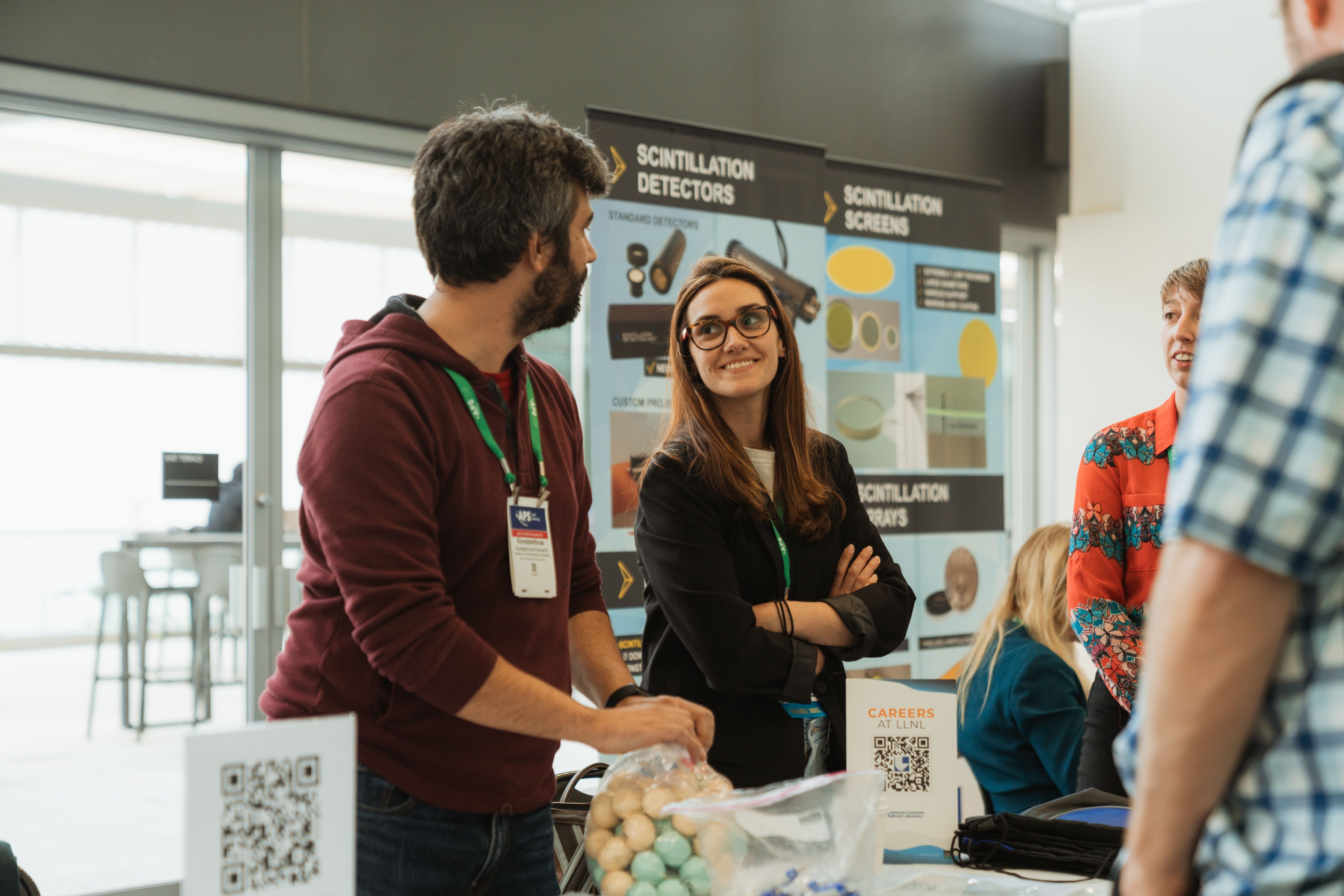Meeting attendee asks a question to an exhibitor at the exhibit hall