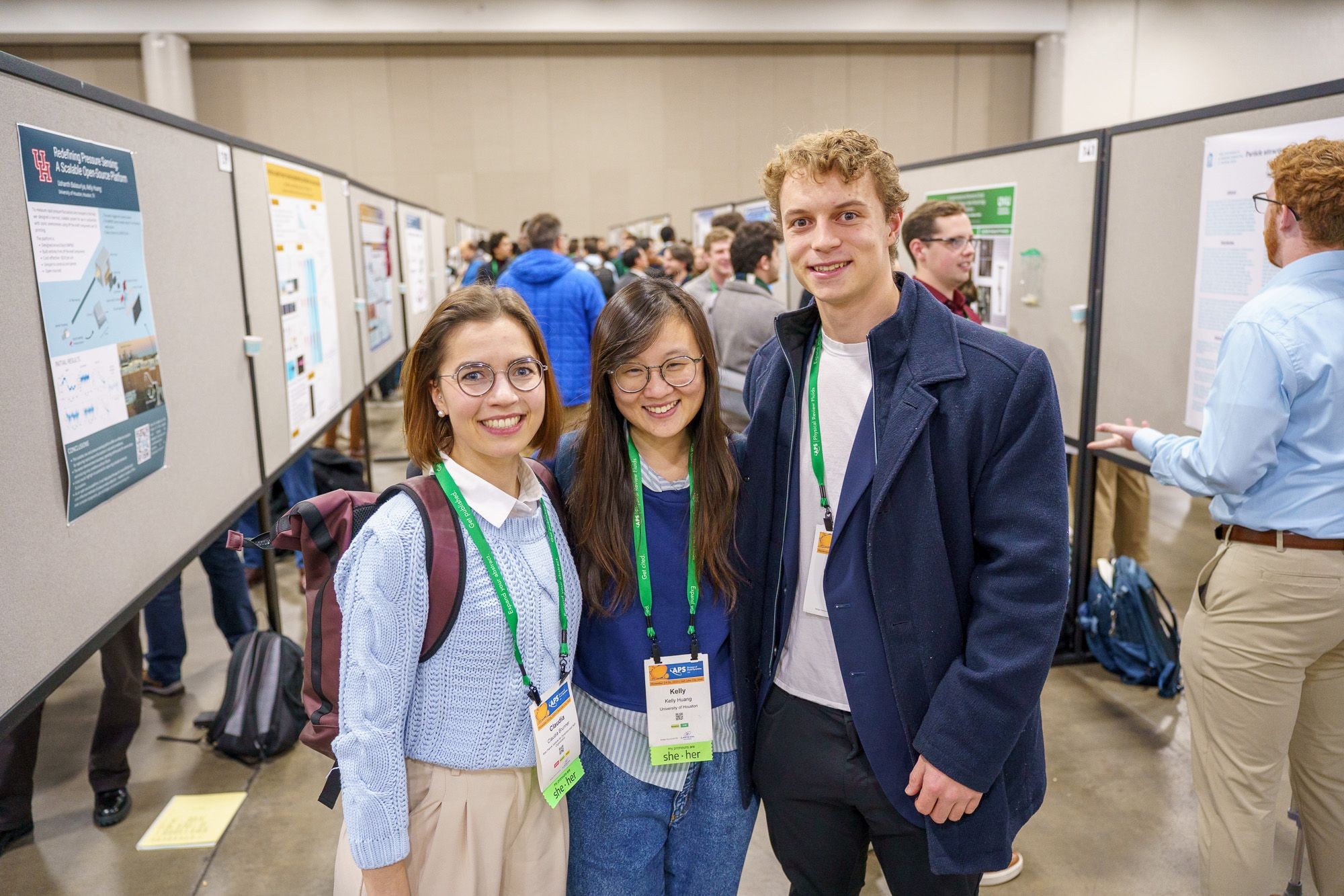 Attendees in a poster session